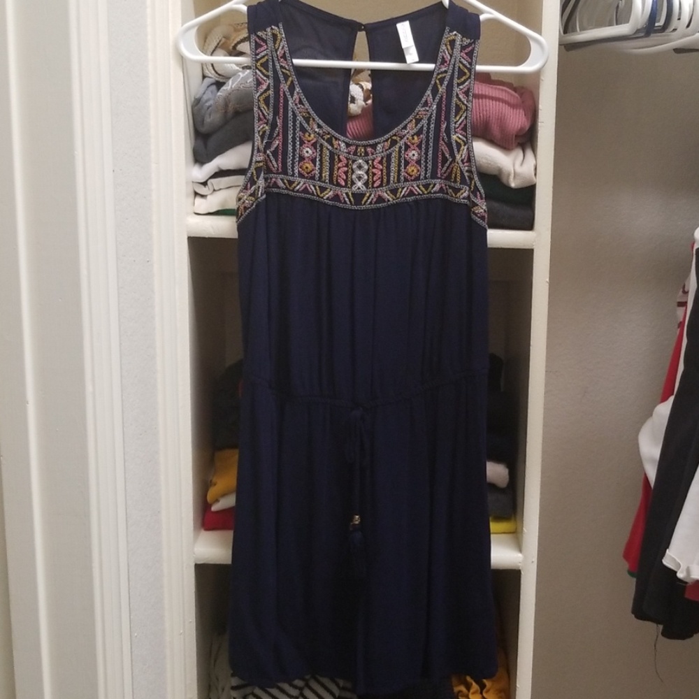 Navy romper with embroidered detailing